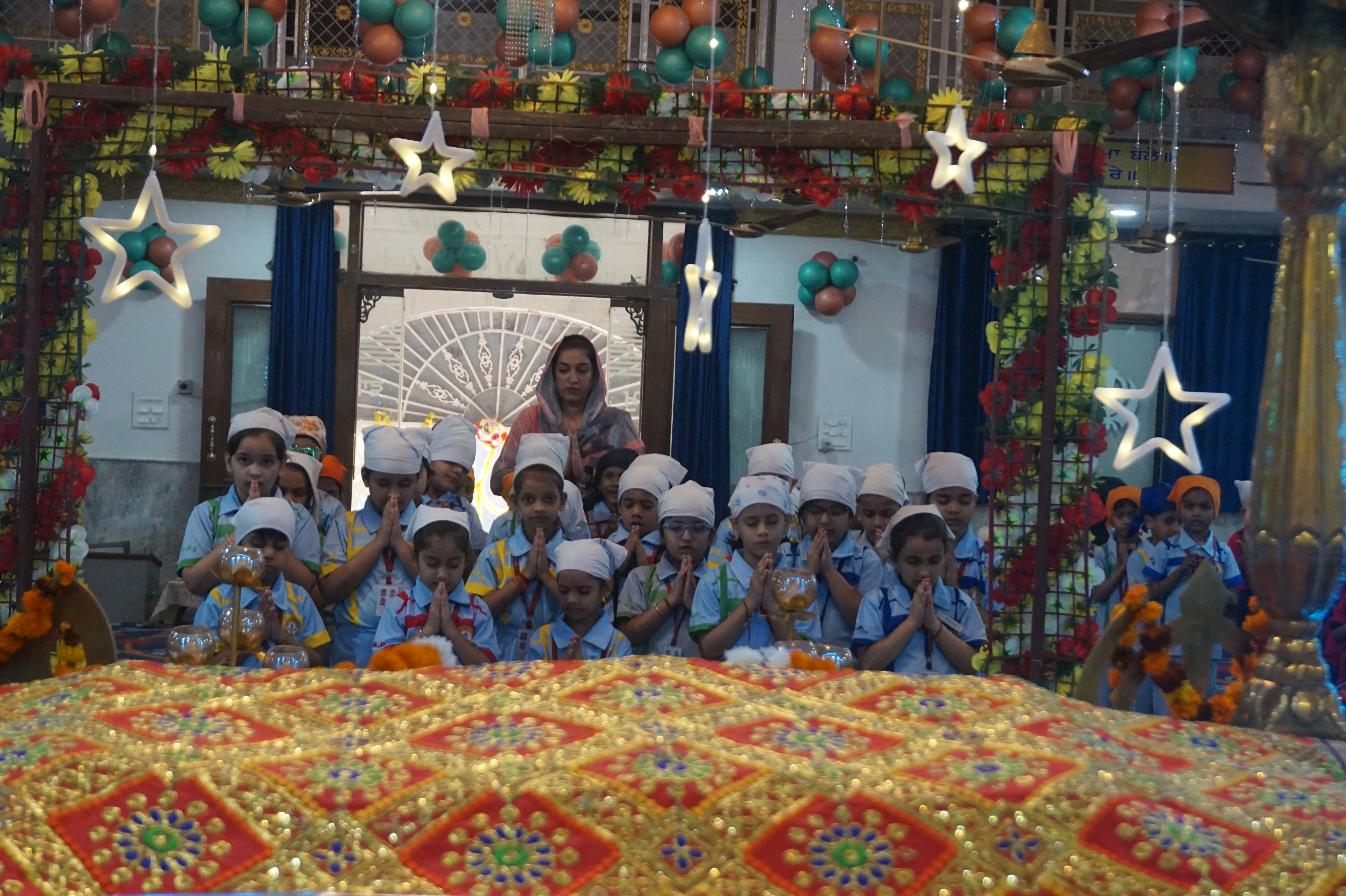 TINY TOTS OF CLASS L.K.G. PRACTICALLY LEARNING THE PROCEDURE TO POST LETTERS